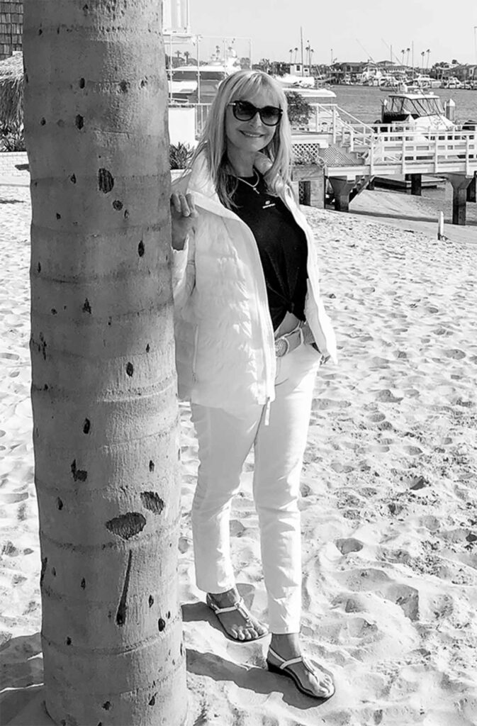 mature woman is walking along the marina