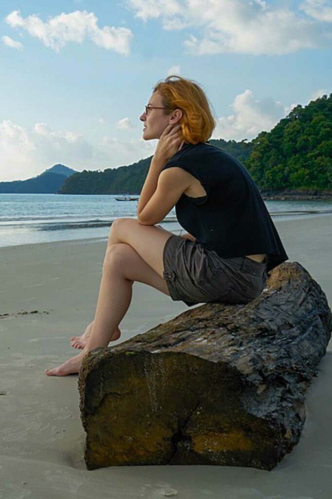 sad woman sitting on a lot thinking